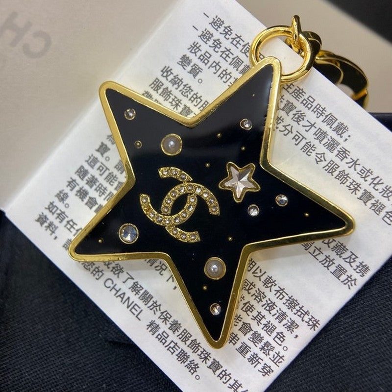 18K  Chanel Black Gold Star Brooch