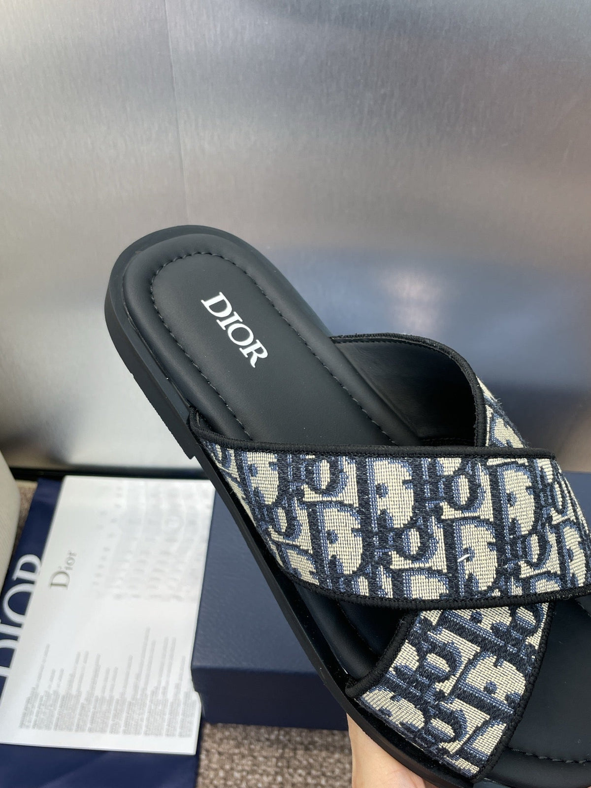 DIOR 25S ALIAS CROSS-STRAP SLIDES IN BLACK CALFSKIN WITH CD OBLIQUE DEEP BLUE LOGO